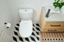 A Bidetmega in a bathroom with a sink.