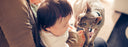 cat looking at baby
