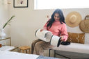 A woman taking an air filter out of her Airmega 50.