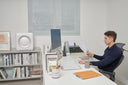 A man working at his desk in an office.