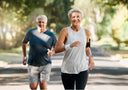 An older couple running.