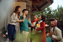 A group entering a home for a holiday party.