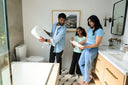 A family setting up a bidet in their bathroom.
