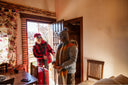 A family arriving home in the winter.