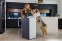 A woman with her pet and the Airmega ProX